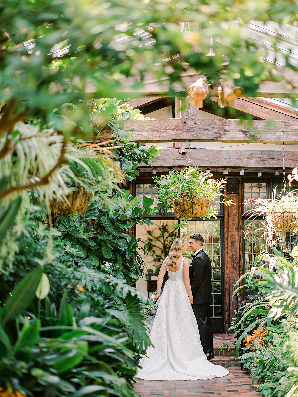 Bride and Groom portrait in greenhouse at Pleasantdale Chateau