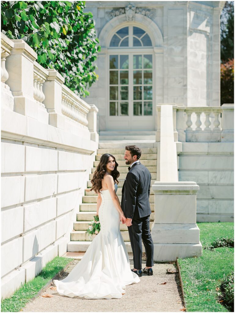 Bride and groom portrait at grand staircase of the Elms garden in Newport, RI
