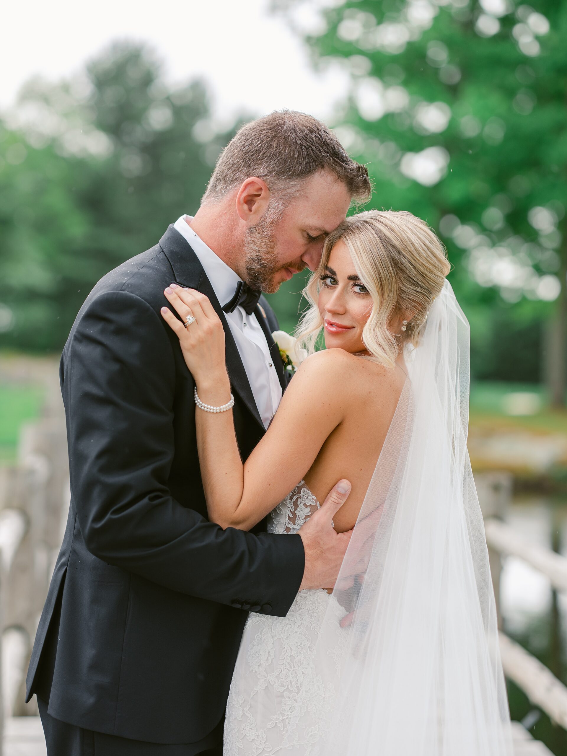 Classic bride and groom in greenery